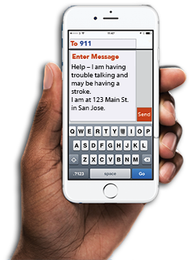 Cell phone image held in a hand displaying a sample 911 text message that says, "Help - I am having trouble talking and may be having a stroke. I am at 123 Main St. in San Jose.
