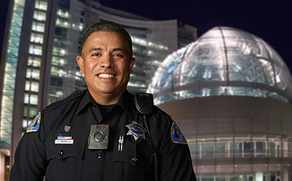 smiling officer wearing a body cam