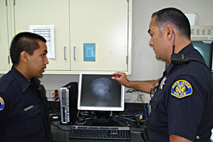 officers looking at a computer